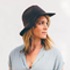 a woman wearing a dark hat